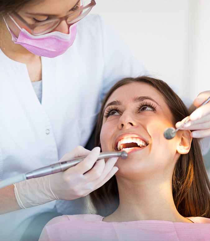 Patient receiving one-visit dental restoration