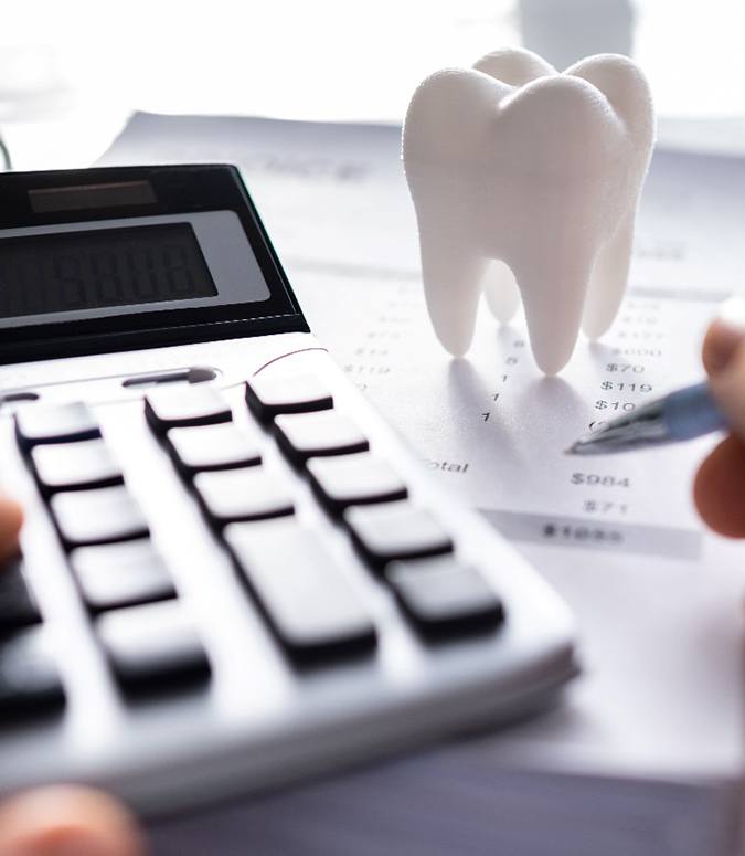 A patient calculating the cost of dental crowns