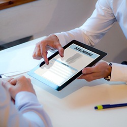 An insurance agent discussing dental insurance with a patient