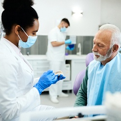 dentist explaining dentures in Englewood