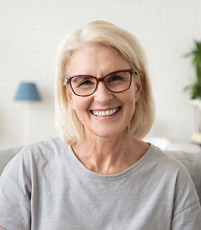 Elderly woman with dentures in Englewood smiling