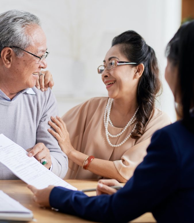 Man and woman discussing the cost of dental implants