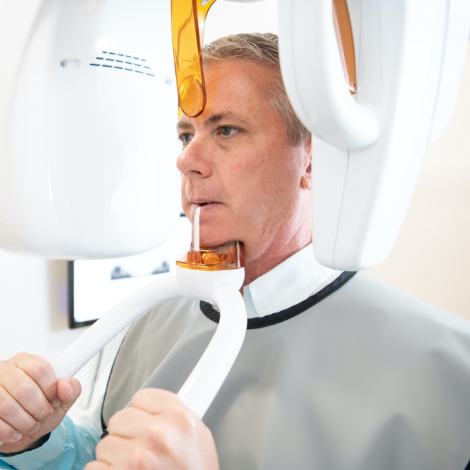 Man receiving 3 D C T cone beam x-ray scan