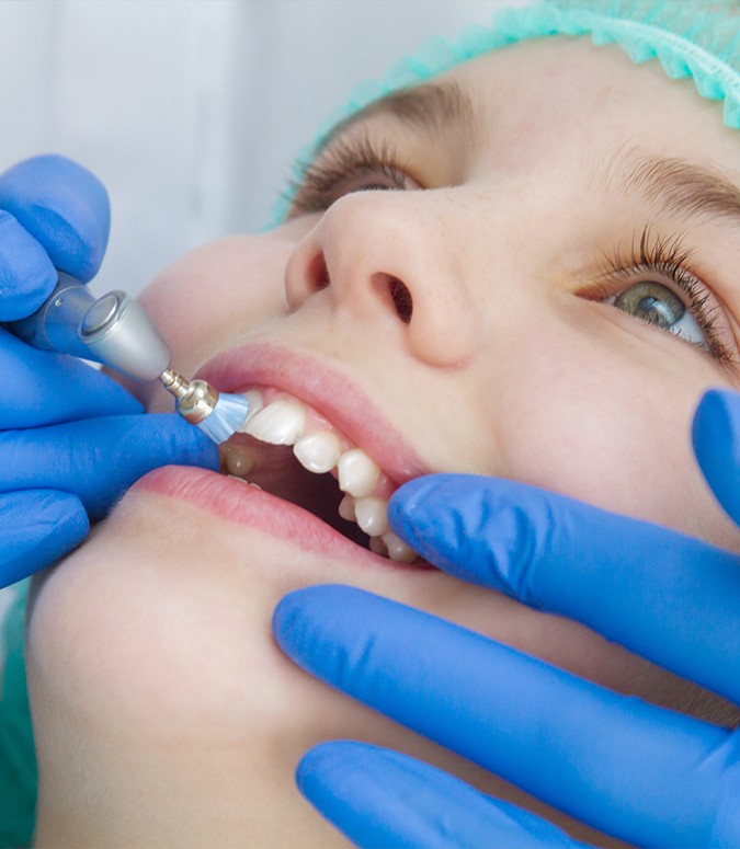 Child receiving silver diamine fluoride treatment