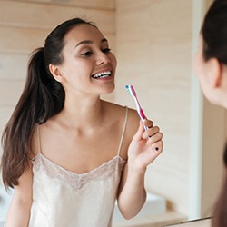 Woman holding toothbrush