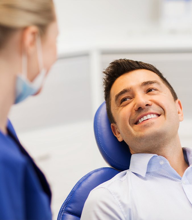 Man relaxing under I V dental sedation