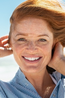 Woman with gorgeous smile after cosmetic dentistry