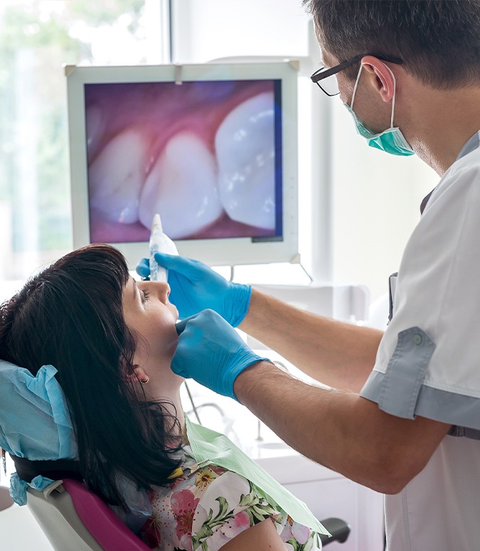 Dentist using intraoral camera to capture an image