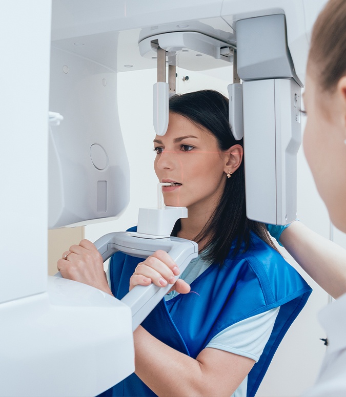 Patient receiving 3 D C T cone beam x-ray scans